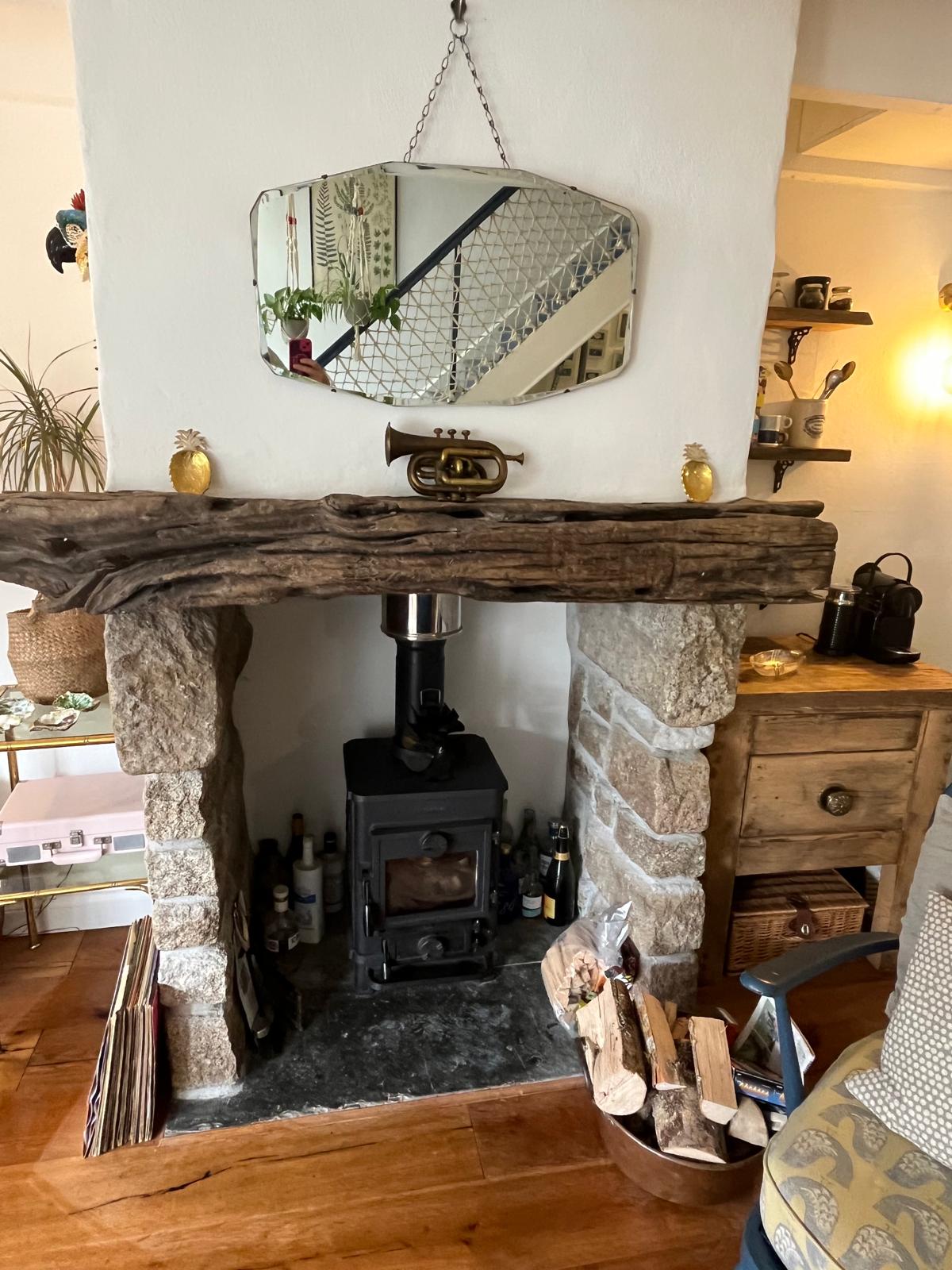 Log burner corner with logs stacked ready