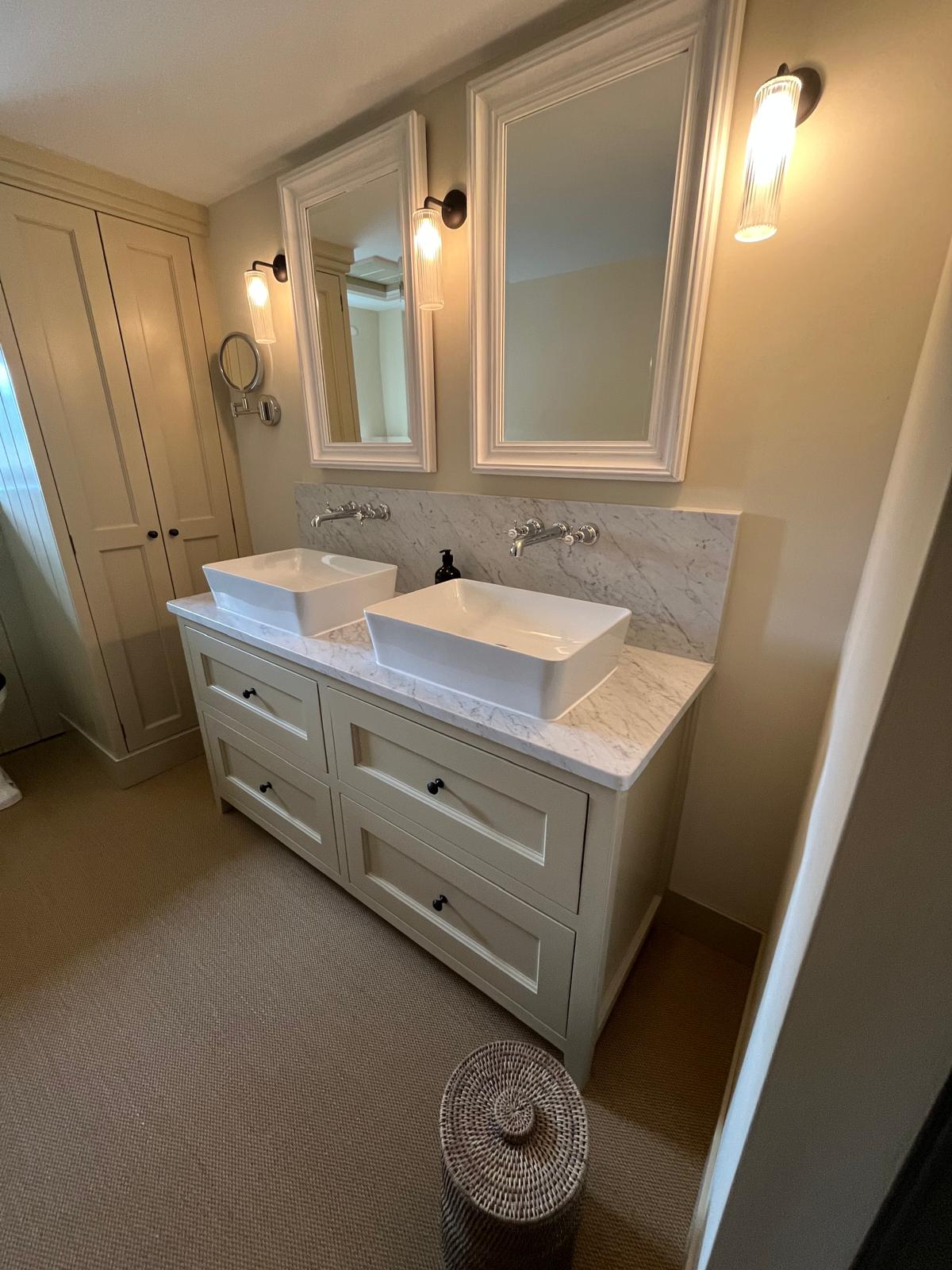 Traditional twin-sink bathroom with marble vanity