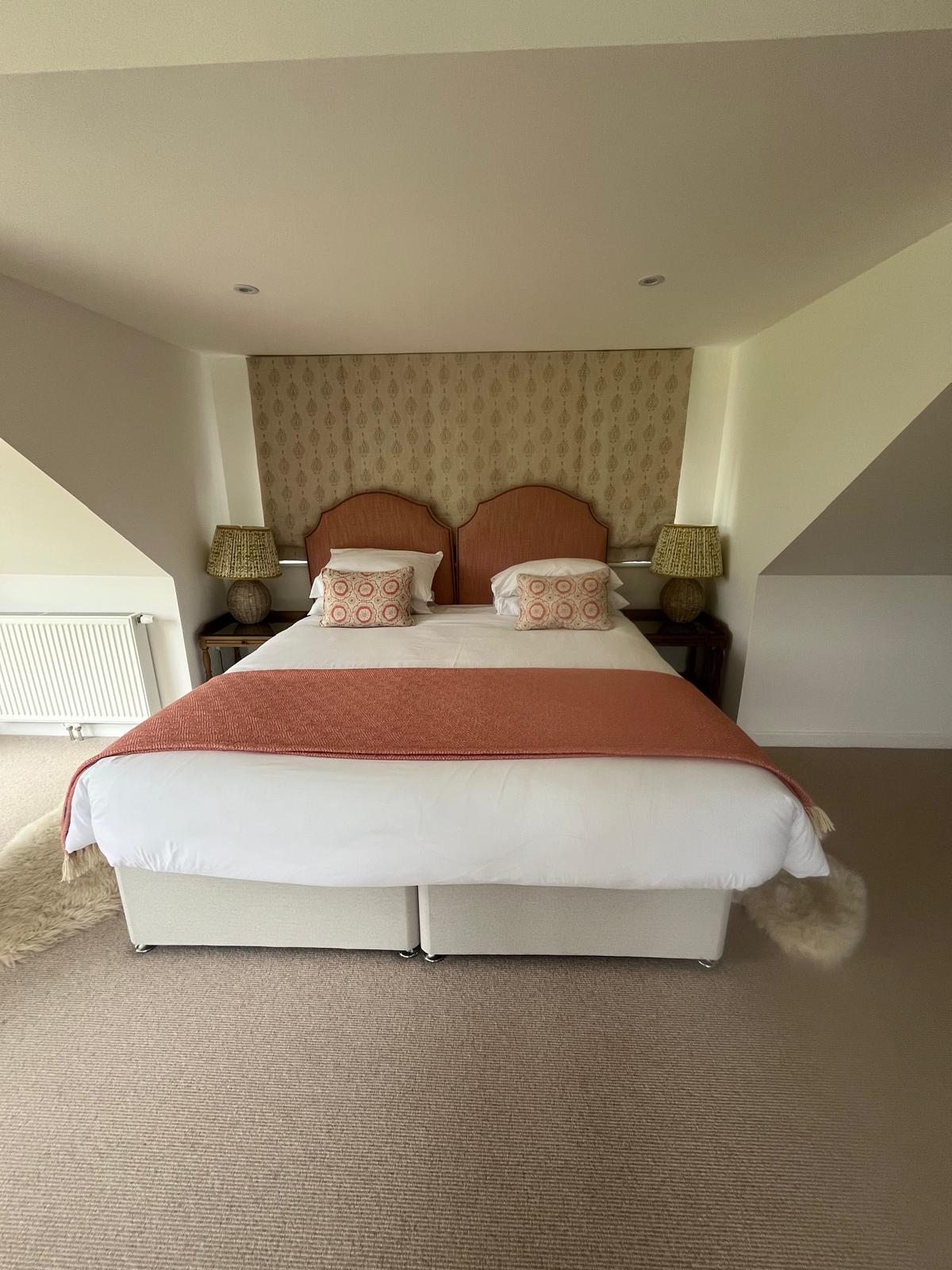 Attic bedroom freshly made up for guests